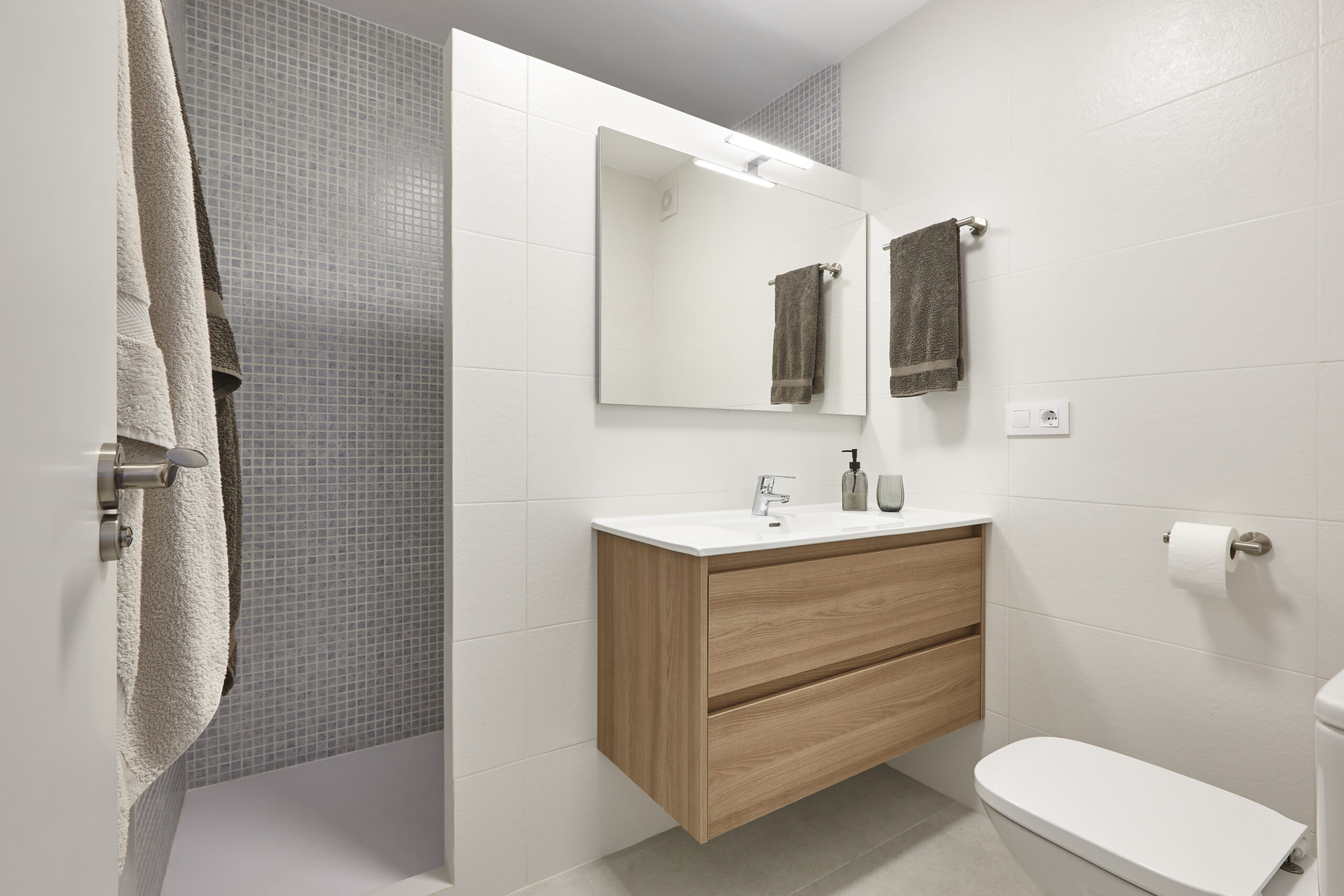Compact ensuite bathroom with walk-in shower